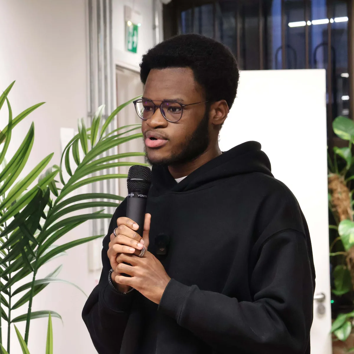 Sipho Yawe speaking into a microphone